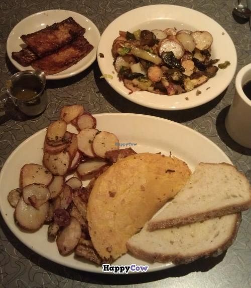 bottom: tofu omlette, breakfast potatoes, and toast; top: seitan chorizo and vegetable potato hash, side of tempeh bacon at Veggie Galaxy in Cambridge