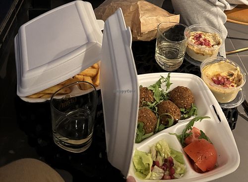 Falafel plate with fries, hummus, baba ganoush, salad, and pita.   at House Falafel & Hummus in Warsaw