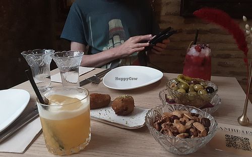 First cocktails with croquettes, olives and spicy nuts. at Amberes The Vegetarian Wine And Cocktail Bar in Valencia