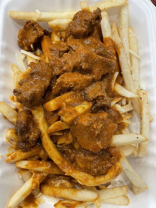 Butter chicken on fries  at Vegango in Edmonton