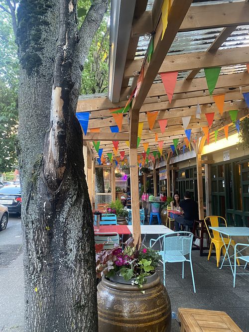 Outdoor Seating Area w/Friendly Service  at Bangrak Market in Seattle