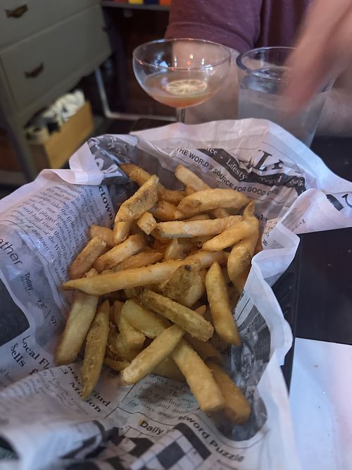 We only ate half the huge basket of fries!   at Hugo's Bar & Grill in Montpelier
