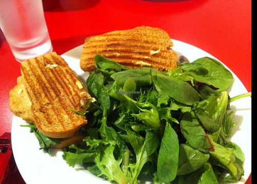 vegan chicken spinach and artichoke panini with side salad.  dip the panini in the balsamic vinegar for extra flavour! at Red Velvet Cafe - Fashion Show Mall in Las Vegas