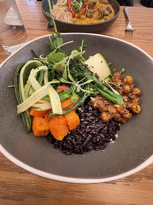 Buddha bowl (Thai green curry in the background)   at Remedy Kitchen in Manchester
