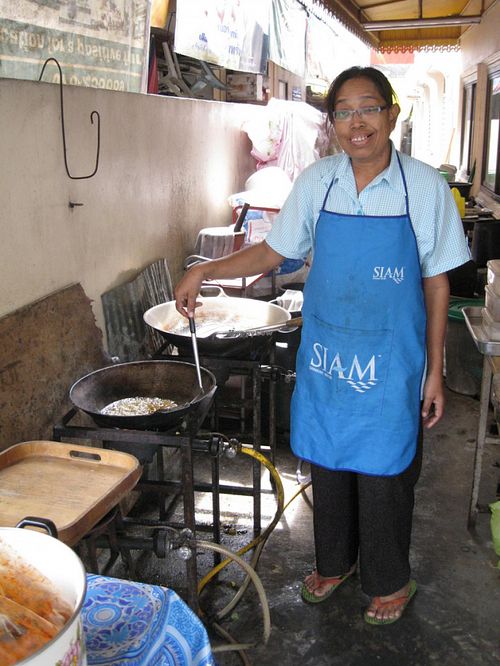 One of the sweet ladies that worked there. She is making a mock duck dish for me, to take to the airport next day - since there is never any food there I want. at Vegetarian Food - Patong in Phuket