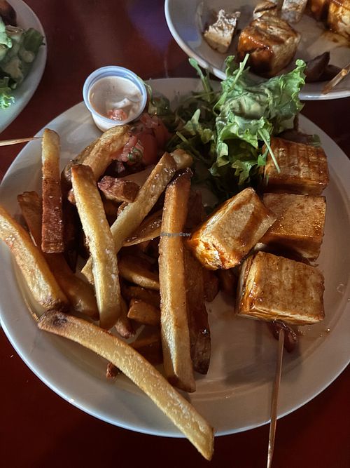 Tofu skewers enteee with salad and fries at Tin Box in Vieques