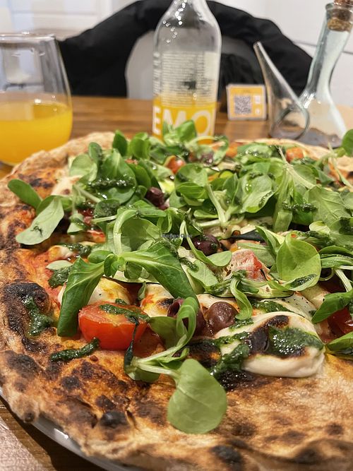 Pizza with their own homemade cashew nuts cheese 🤤   at Mitoa Pizzeria in Barcelona