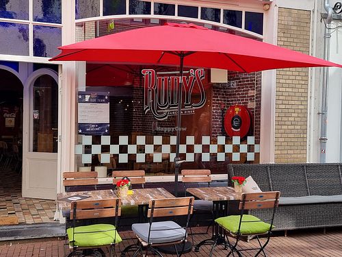Front with outdoor seating at Rudy's in Weert
