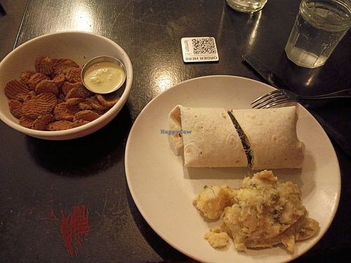Many veggie wrap, herb roasted potatoes and fried pickles at Botanical Plant-Based Fare in Charlottesville