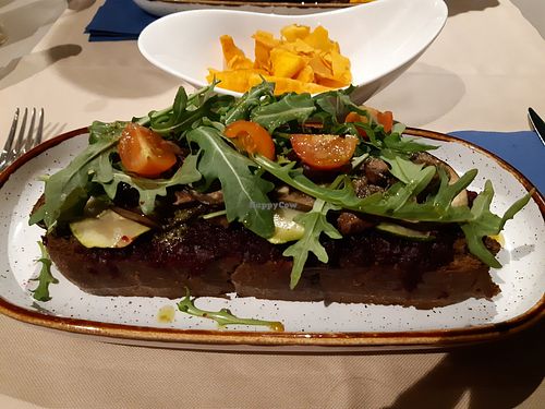 Big vegan sandwich with sweet potato chips at Hostel and Suites des Arts in Amarante