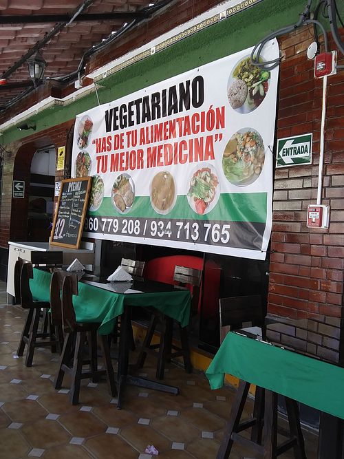 Poster and menu on patio area at Restaurante Union Vegetariano in Lima