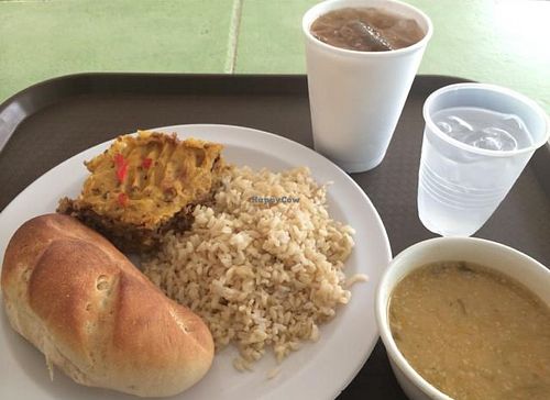 Lunch: Pastelon, rice, white beans, bread with Tamarind juice  at Ananda Restaurante Vegetariano in Santo Domingo
