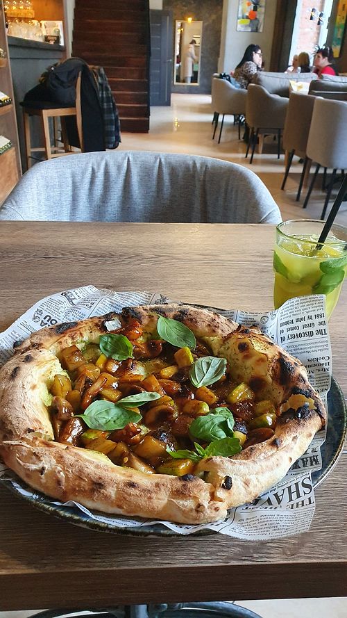 Pizza with baked vegetables and sesame sauce at Salsa Bistro in Vitebsk