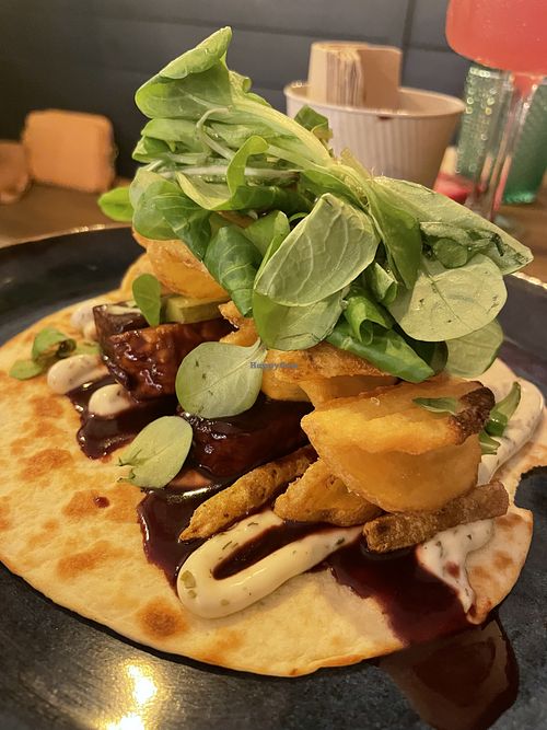 Tempeh bab with potato fries on tortilla  at Meet Vegano in Malaga
