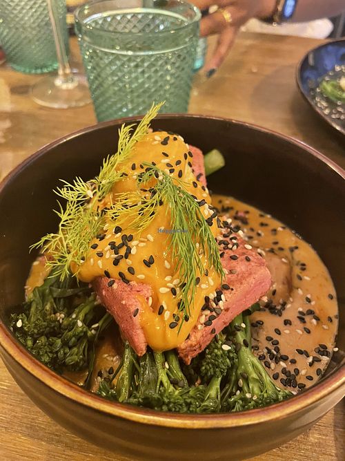 Salmon tofu on broccoli and potatoes in creamy sauce  at Meet Vegano in Malaga