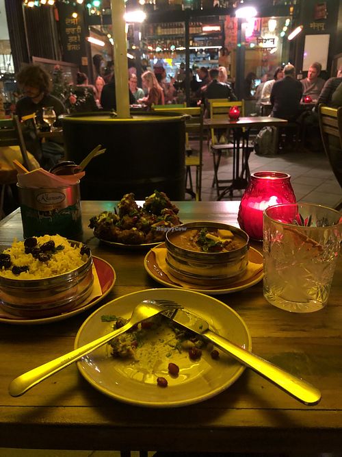 R-L: Dark and desi cocktail (rum+ginger beer+fresh lime), Boom Ting Butter Paneer, Bang Bang Bhaji (vegetable fritters) and Pilau rice.   at Mission Masala in Antwerpen