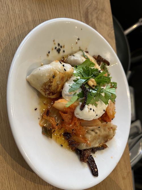 Nomadengelüste dumplings with kimchi and schmand on top  at Plagwitz Samstags Markt in Leipzig