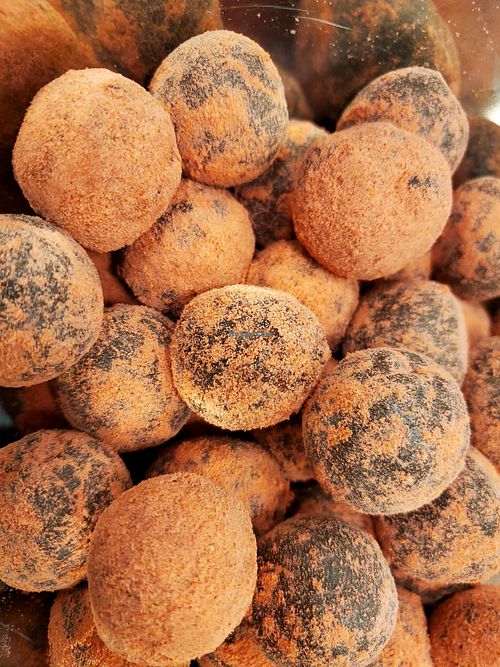 Chocolate Strawberry powdered donut holes. Gluten and processed sugar free.  at Intuit Raw Foods in Lincoln