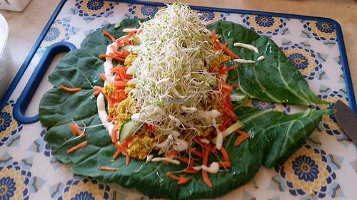 Curry Cashew Collard Wrap fill with fresh veggies, curry cashew nut pate and a cream sauce.  at Veggie Love Food Truck in West Palm Beach