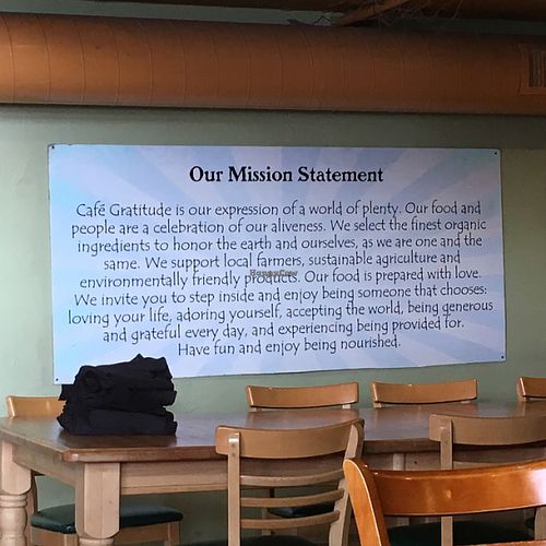 Cafe Gratitude Mission Statement on wall at cafegSC in Santa Cruz