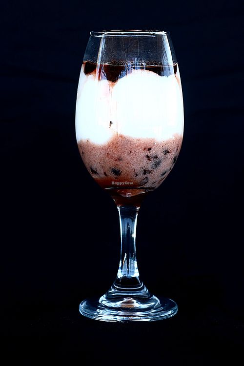 Panna Cotta with Coconut Cream and Spices with berry syrup. at Praana Pousada e Restaurante in Nisia Floresta