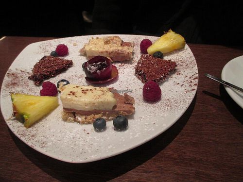 Dessert plate with little cakes and fruit at Ecco in Cologne