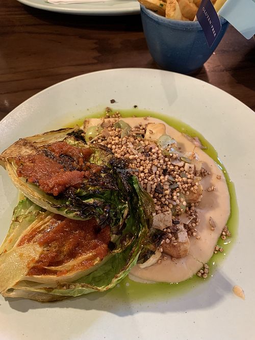 Update: Their offerings are far reduced and lacking thought. I am not a fan.


Pictured is old menu item: Celeriac cubes, bean purée, grapes, seed granola mix, charred lettuce with tomato purée, basil oil  at Cote in Winchester