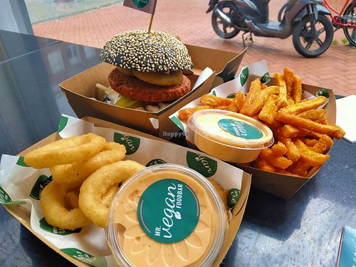 Super yummy gooische burger, sweet potato fries and onion rings, all of these with a side of sriracha-mayo at Mr. Vegan Foodbar in Groningen