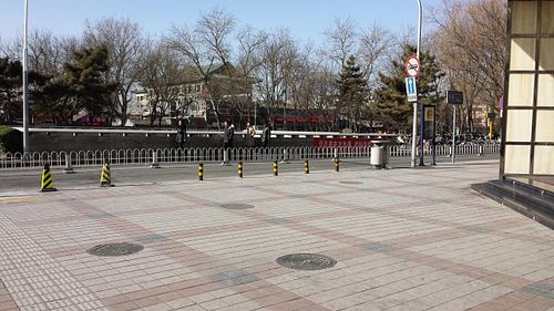 Turn right here on Dong'anmen St. This is standing next to Golden Jaguar noted in the directions at Fu Hui Ci Yuan Vegetarian Restaurant in Beijing