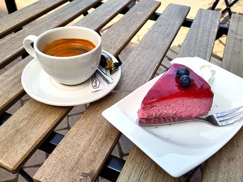 Vegan berry cake and coffee at Cake House Café in Tampere