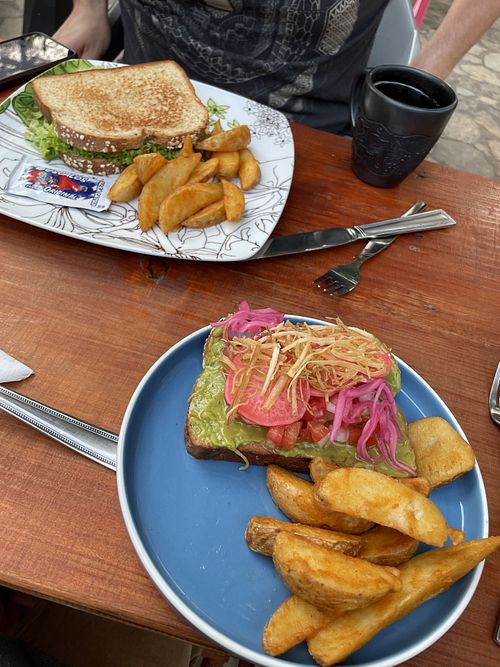 Breakfast! Avocado toast and grilled cheese Bread with fruit and coffee  at La Tradición in Palenque