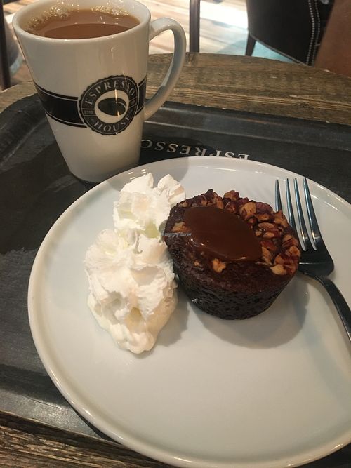 A vegan pecan brownie with a vegan caramel and an oat whipped cream. Also oat milk available for their coffee    at Espresso House in Helsinki