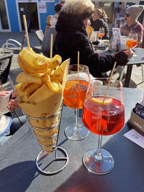 Patatas y aperol spritz  at Trexento in Burano