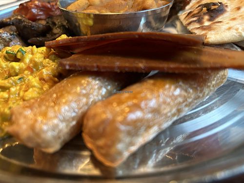 Sausages and bacon   at Thali Tray in Newcastle Upon Tyne