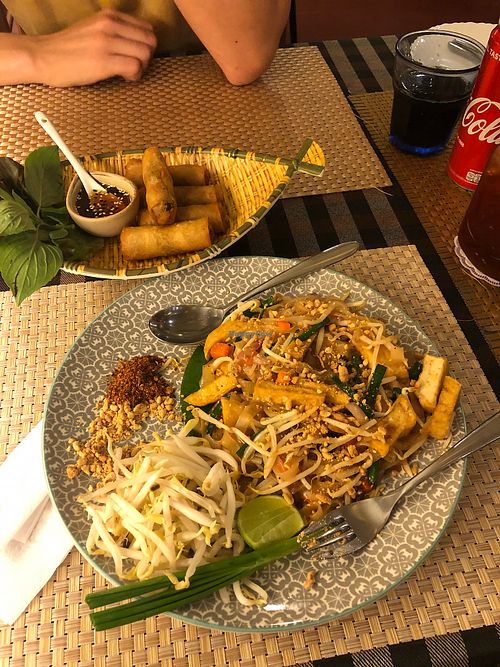 Pad Thai with tofu and fried spring rolls  at May Veggie Home in Bangkok