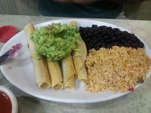Soy chicken taquitos with rice, beans, and guacamole. at Mother's Market Kitchen in Irvine