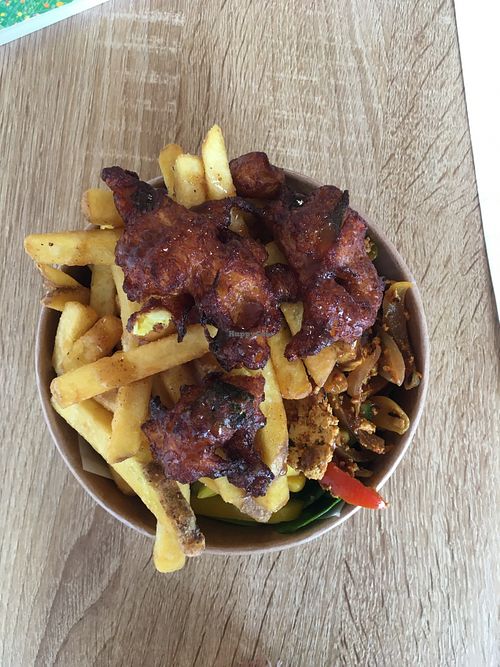 Delicious spicy tofu, mango samosa with salad and chips.  at Earthling in Bournemouth