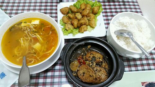 veg fish stew with lemongrass, oriental canna and chili (vegfish homemade from seaweed and soybean sheets), salted veg chicken stirfired (what actually was floured king oyster mushrooms fries with black seasames and lemon leaves) and sour mushroom soup. at Ho Tay in Hanoi