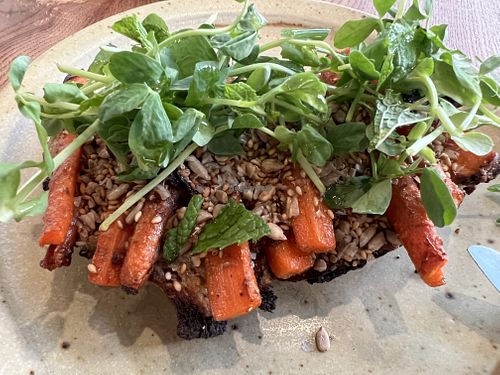 CARROT TARTINE WITH SUNFLOWER SEED TAHINI, VADOUVAN AND MINT  at Little Saint in Healdsburg