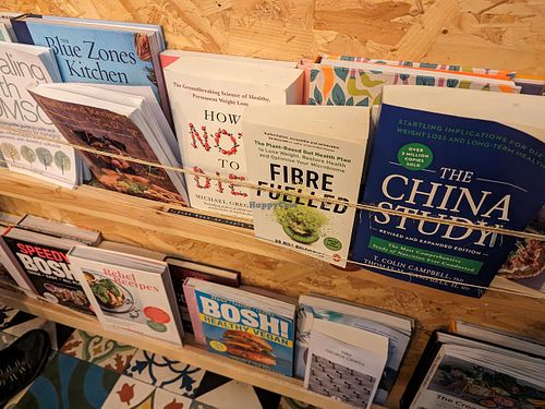 Reading material at VIBE Plant Based Cafe & Restaurant in Douglas