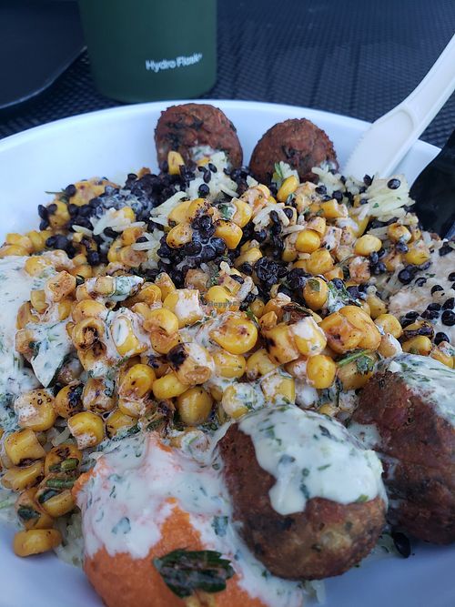 Rice, black lentils, falafel, hummus, corn and tahini dressing at CAVA in Newark