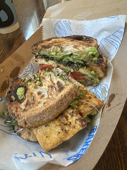 Vegan tofu sandwich, avocado, tomato, and greens  at Black Market Bakers in Edgewater