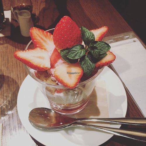 fresh strawberries with strawberry ice cream and cereals  at T's Restaurant in Tokyo