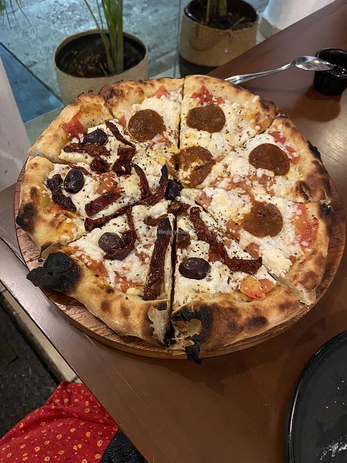 Half sundried Cozumel, half pepperoni de mar   at Coral Vegan Pizza in Playa Del Carmen