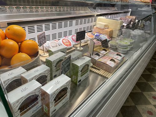 Lots of vegan cheese wheels  at Cigrons & Pèsols in Mallorca