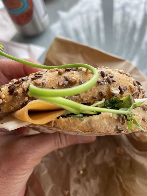 “Turkey sandwich with “cheese” and greens. Very good. Wish there was more “meat” on the sandwich  at Cigrons & Pèsols in Mallorca