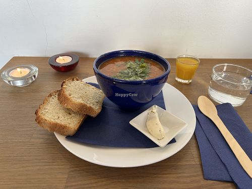 Delicious Lentil Soup, homemade bread, shot of tumeric citrus juice  at La Soupe in Malmo