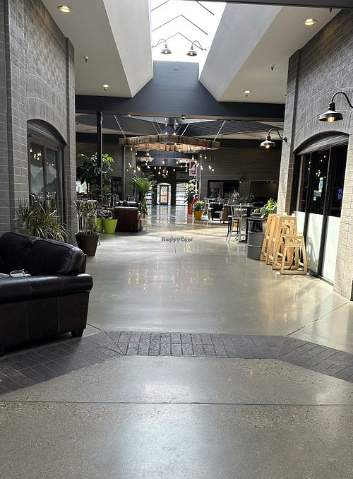 Outdoor space with lots of seating and tables, great for studying   at Button Rock Bakery & Kenny Lou's Deli in Lafayette