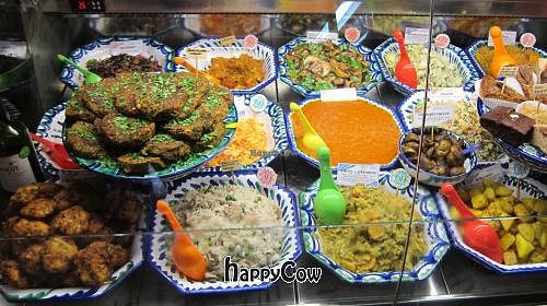 The daily menu inside the deli case at El Piano - Malaga in Malaga