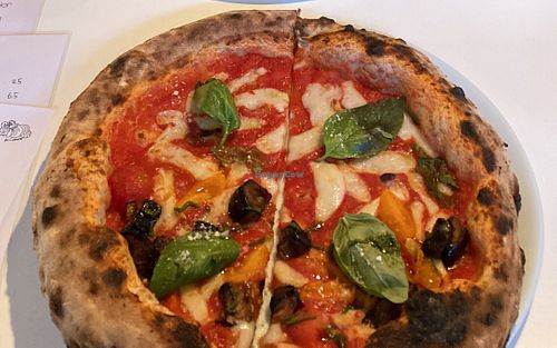 Base of San Marzano tomatoes, homemade cashew mozzarella and Grana Vegano, eggplant fritters, basil, extra virgin olive oil at Al Catzone Pizza Napovegana in Berlin